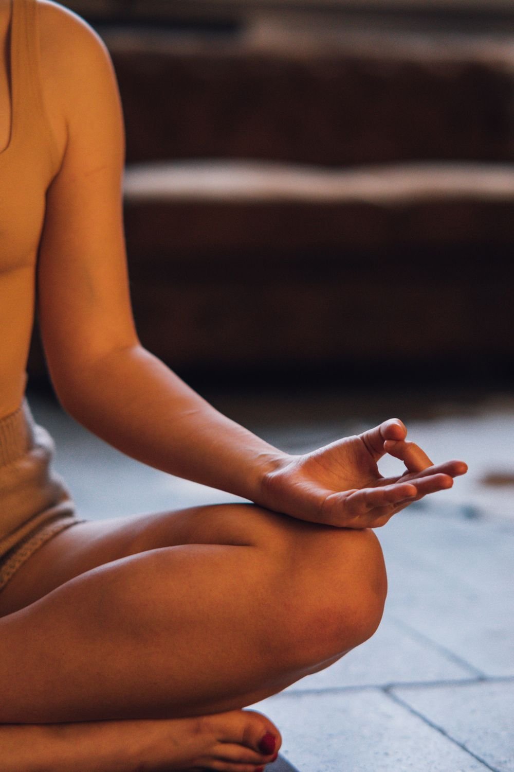 Person meditating, representing mindfulness and mental wellness